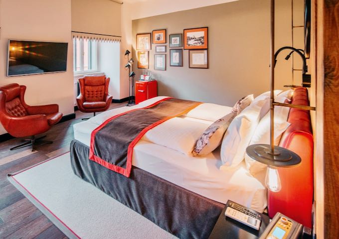 Rooms feature body pillows and leather armchairs.