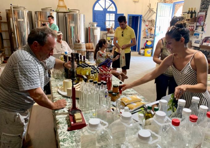 Customer buying a bottle of vinegar at a small winery.