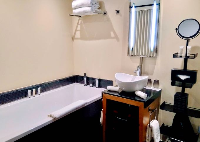 Bathrooms feature bathtubs and Carita toiletries.