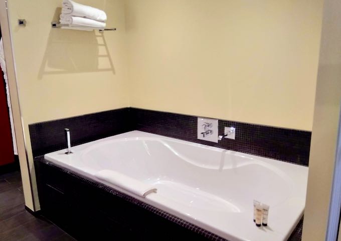 Bathrooms feature bathtubs and rain showers.