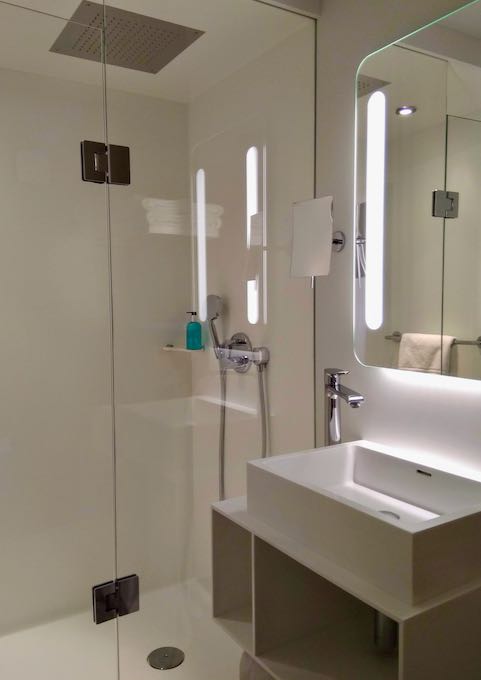 The modern bathrooms are clean and modern.