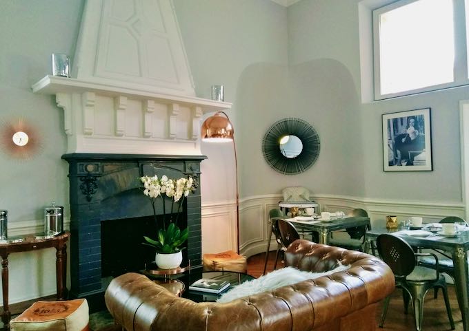 The breakfast room has an elegant fireplace.