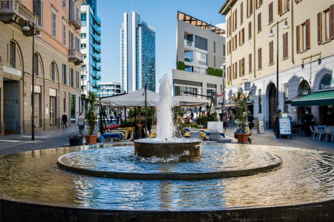 Circulat fountain on a pedestrianized plaza in Milan