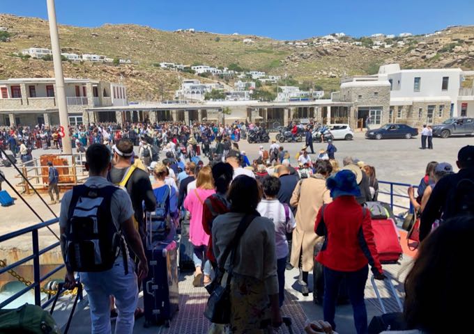 Passengers disembarking a ferry at the New Port of Mykonos