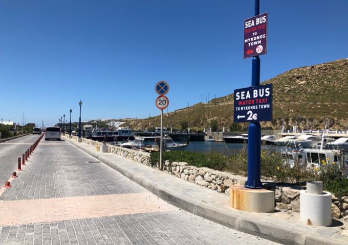 Sign pointing to the Sea Bus dock in Mykonos New Port