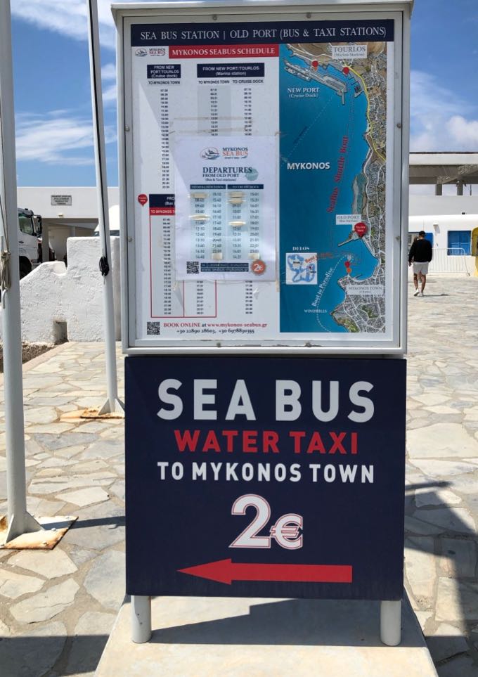Sign pointing to the Sea Bus boarding area in the Old Port of Mykonos