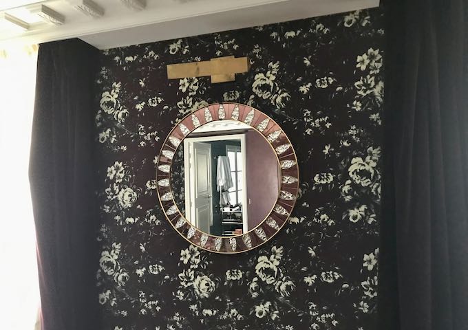 Interesting decor includes antique mirrors.