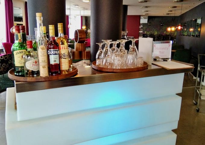 The lobby lounge features an honesty bar.
