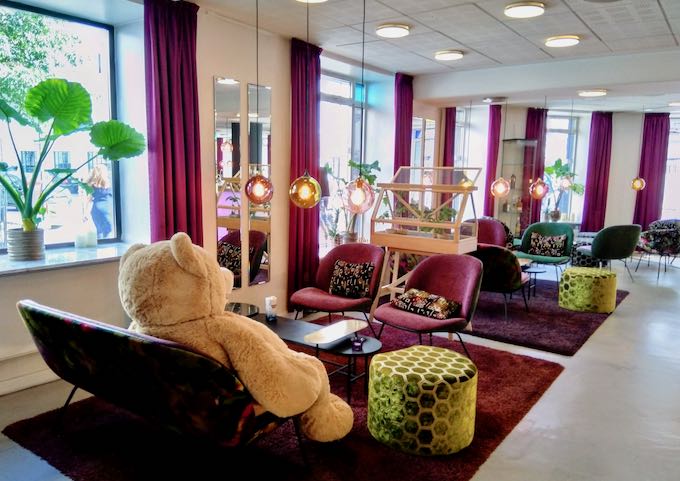 The lobby lounge is colorful and features giant teddy bears.