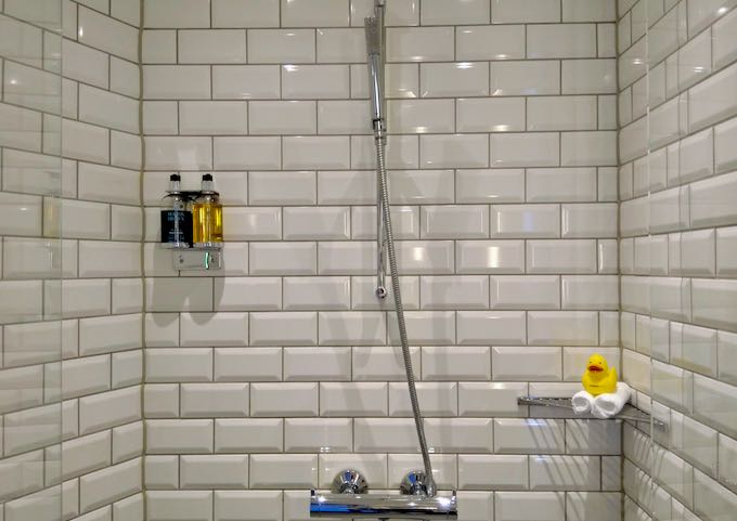 The shower features Molton Brown toiletries and a rubber duck.