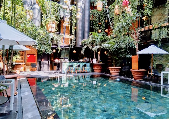 The hotel has a tropical-themed jungle pool with a glass roof.