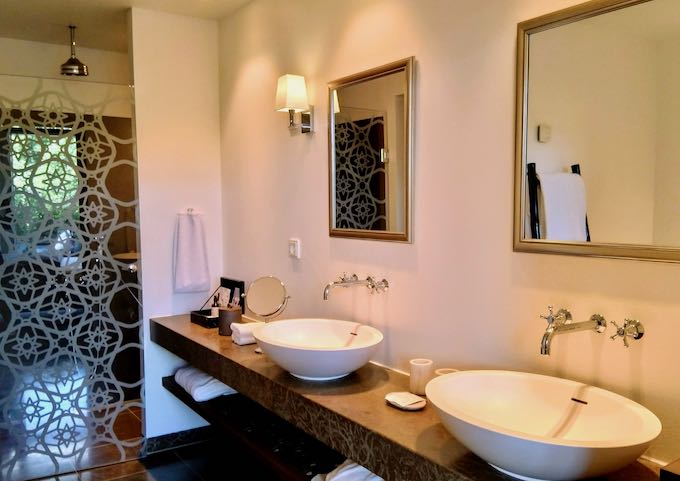 The spacious bathrooms feature twin sinks, shower, bathtub, and Meraki toiletries.