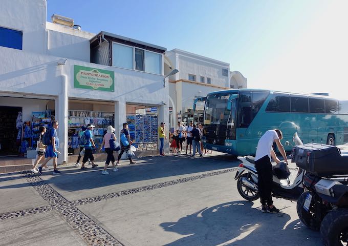Boarding a bus at the Oia bus station.