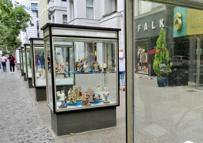 Old-fashioned glass boxes advertise store wares on Kurfürstendamm.
