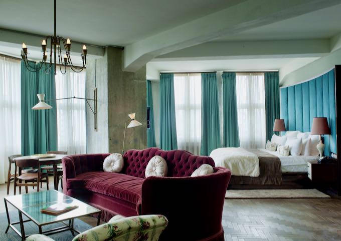 The Large room features an extraordinarily large bed and sofa.