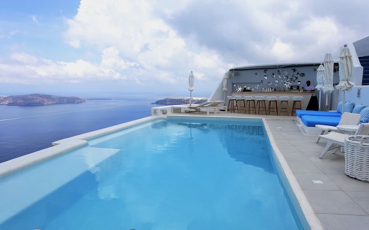 Pool, bar, and view from Astra Suites in Imerovigli