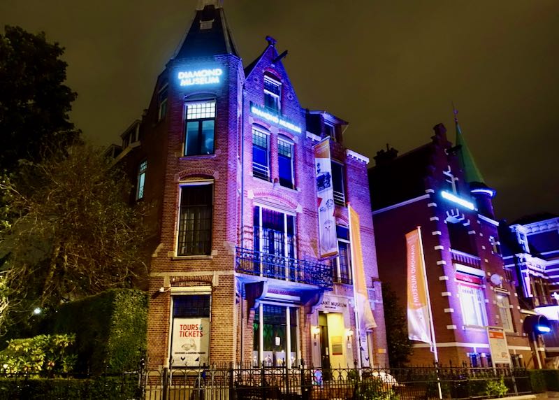 Exterior of Amsterdam's Diamond Museum, lit up at night