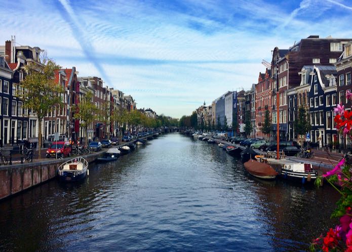 Canal lined with buildings in Amsterdam