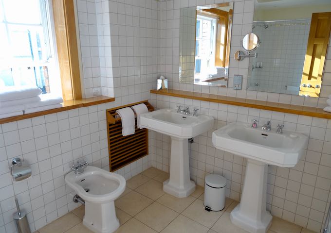 Bathrooms are large and feature bathtub-shower combos.