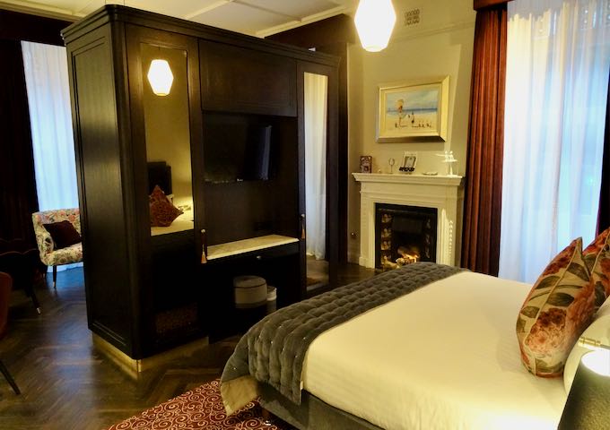 Some suites feature a room divider-cum-wardrobe.