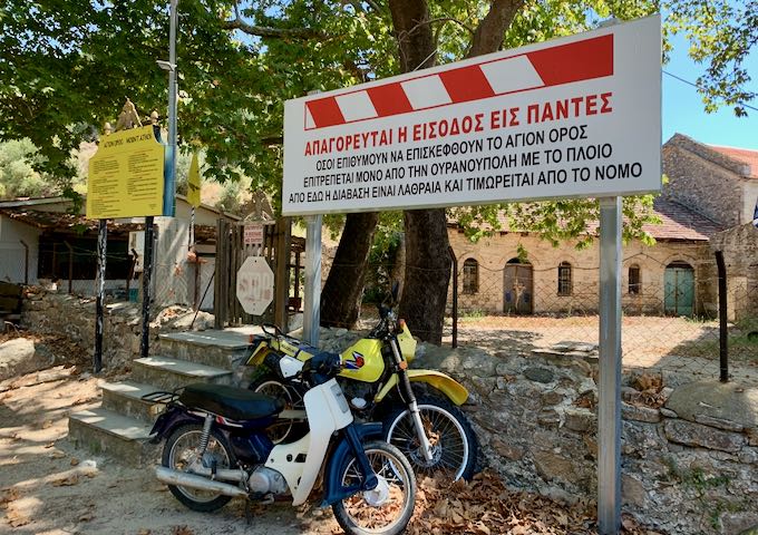 Barricade at a Greek Monastery, with two motorcycles parked nearby