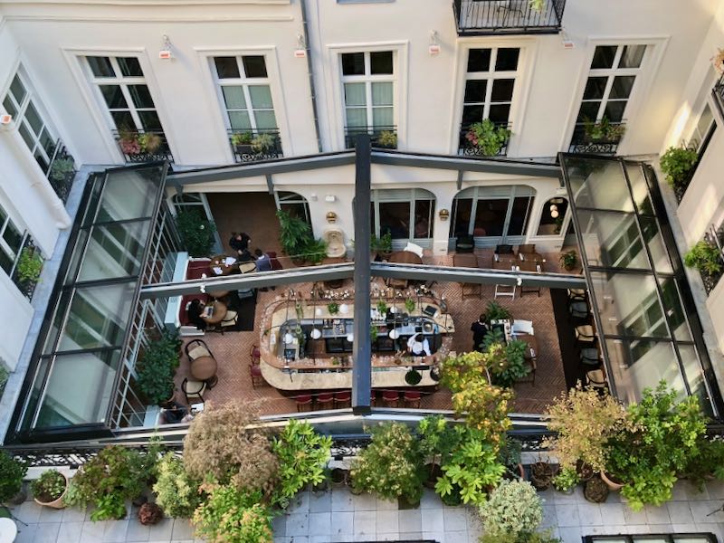 Overhead view of a hotel courtyard cafe in Paris