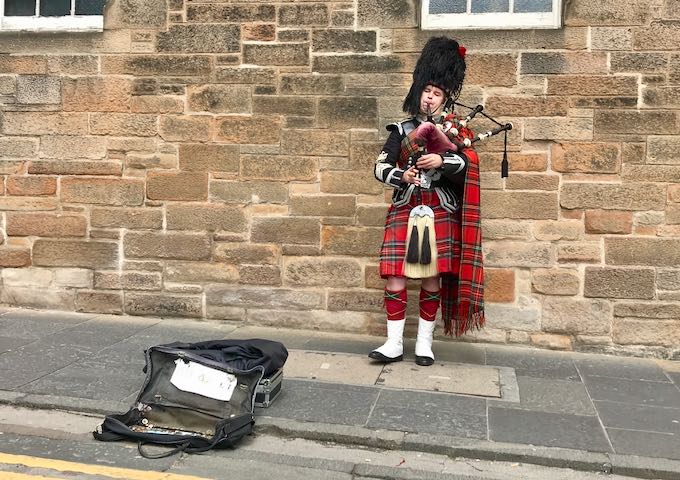 Buskers play bagpipes along the Royal Mile every day.