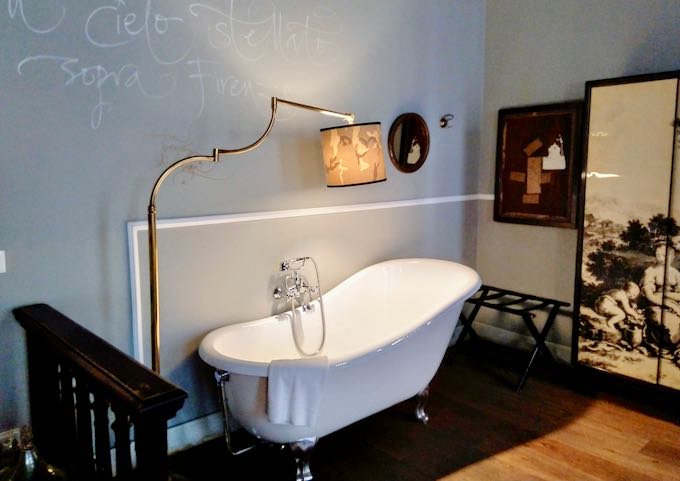 The bedroom has a free-standing bathtub.