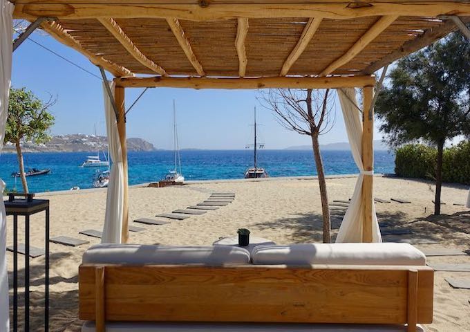 Private beach and patio at Bill and Coo Coast Suites in Agios Ioannis