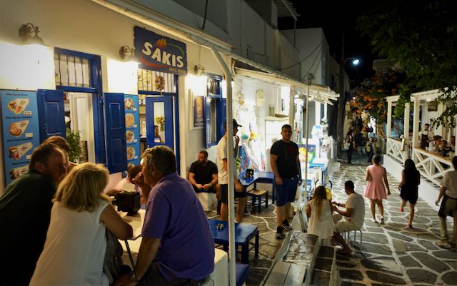 A busy souvlaki restaurant in Mykonos Town at night