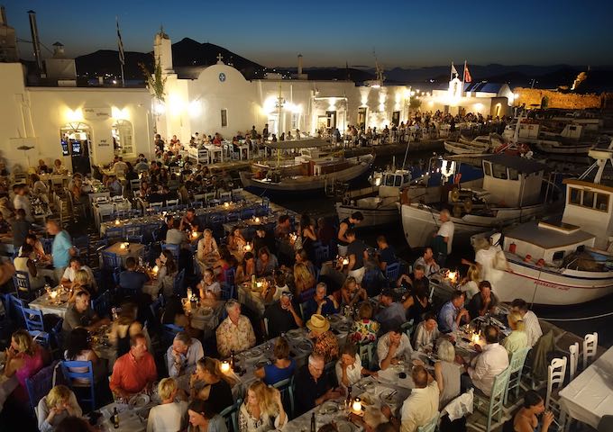 Crowds of diners at Naoussa old port in Paros