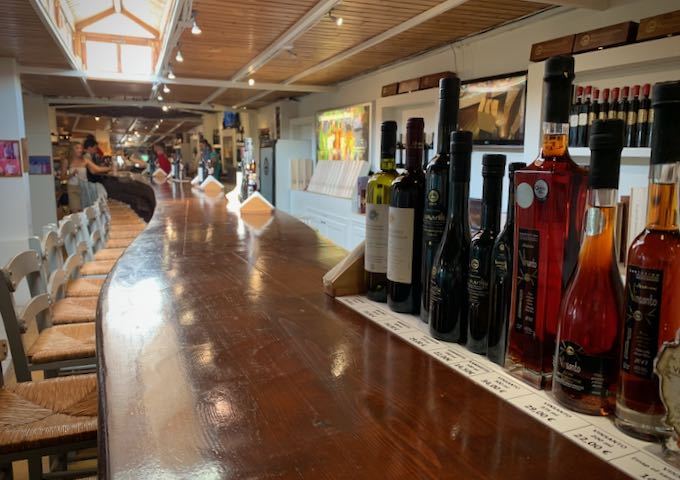long wooden bar, set for wine tasting