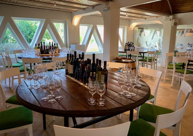 Tables set with bottles and glasses for wine tasting