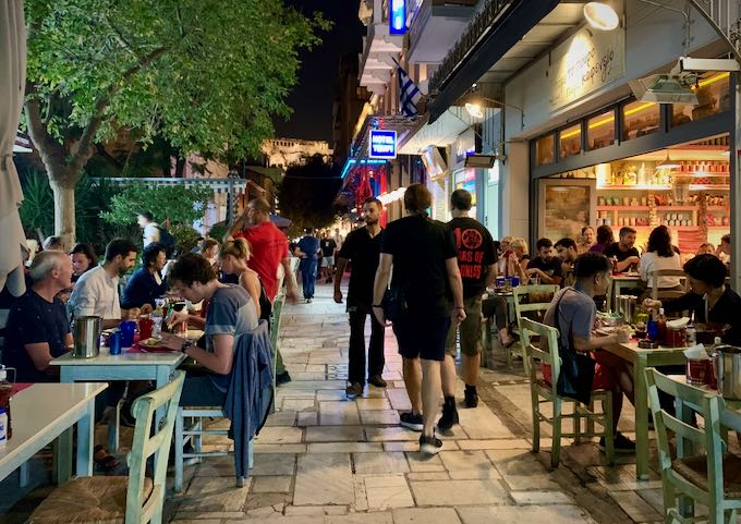 a crowded street in Athens at night