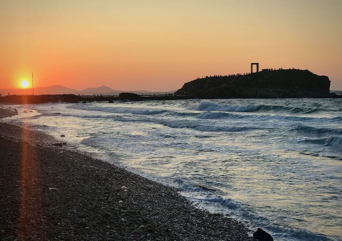 Sunset on Naxos island, with the Portara of the Temple of Apollo in the distance
