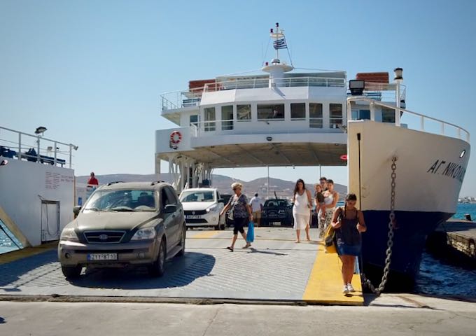 A car ferry unloading cars and passengers at a ferry dock