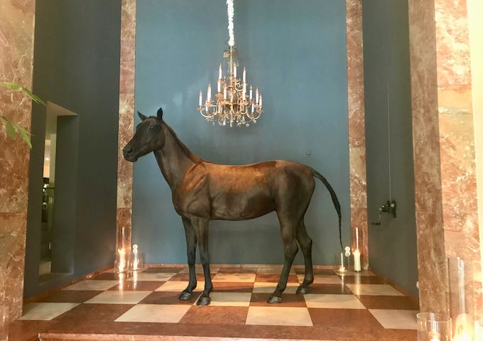 A taxidermy horse is in the lobby.