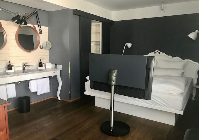 Most rooms and suites have a dark grey and white color scheme.