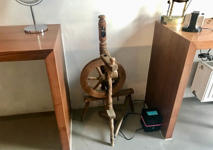 The ex-tailor shop suite has a spinning wheel.