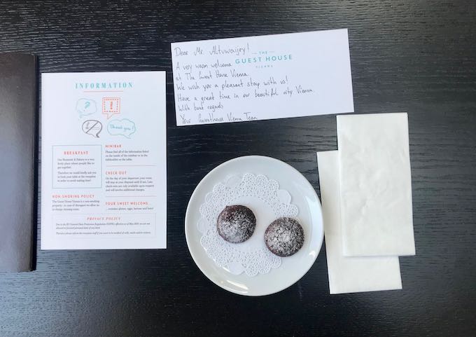 A hand-written note and chocolates welcome guests.