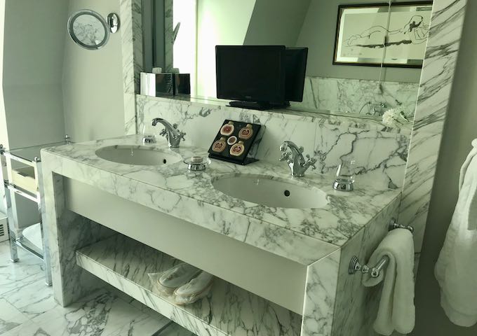 Bathrooms feature fine marble.