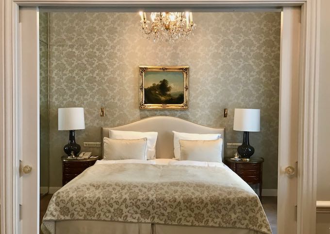Rooms have matching wallpapers and linens.