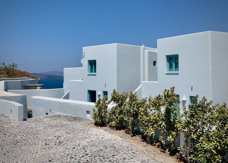 White, Cycladic, block-style houses with the Aegean sea in the background