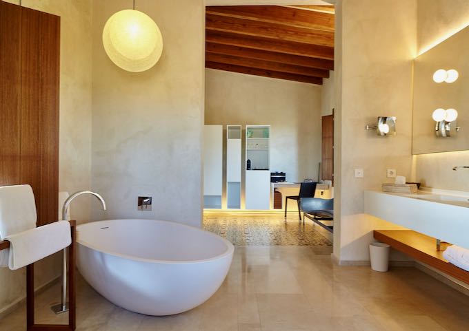 The bathroom has a huge bathtub.