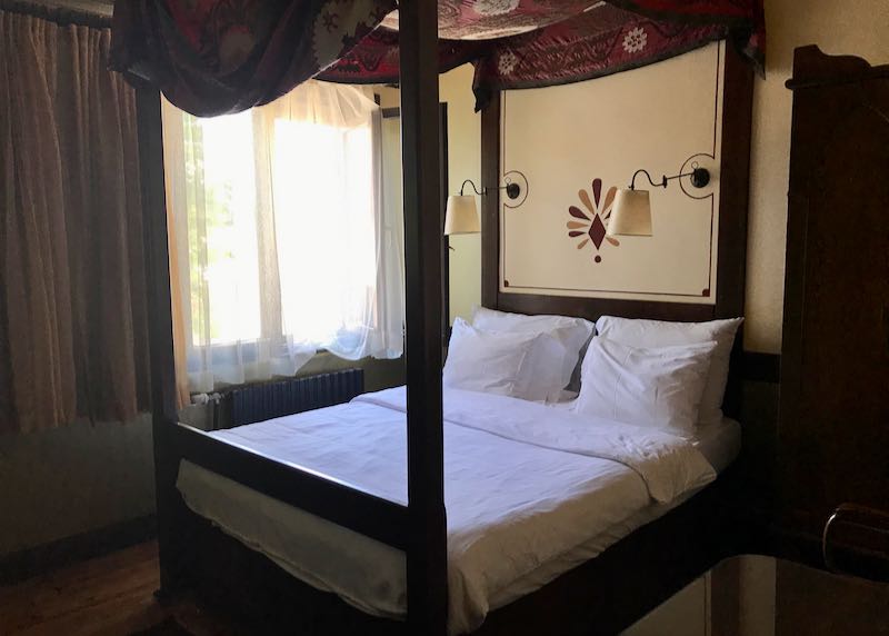 Another room also has a canopied four-poster bed.