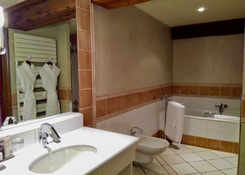 Bathrooms are spacious and feature bathtubs.
