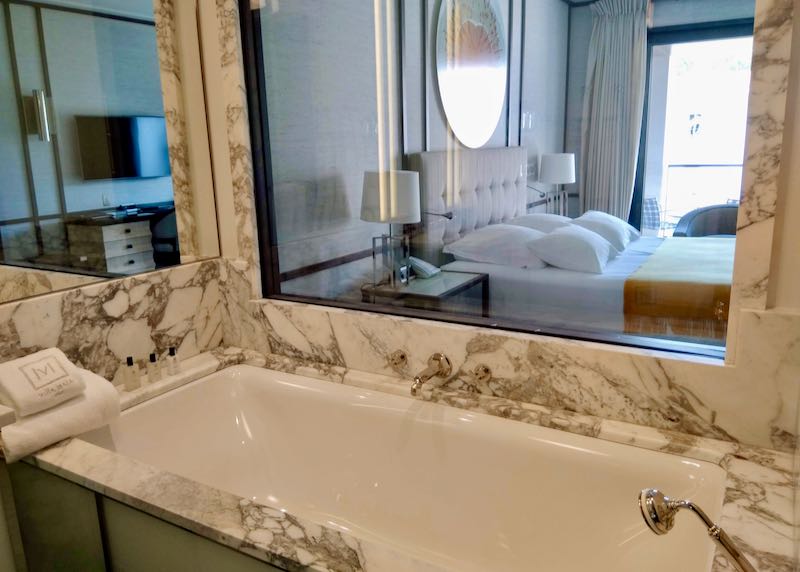 The plush bathrooms feature Carrara marble.
