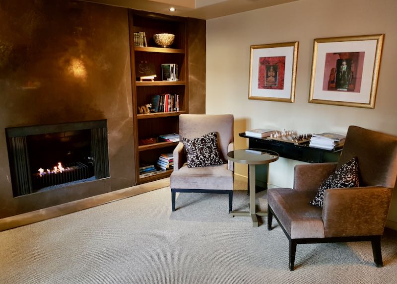 The guest lounge has a welcoming fireplace.