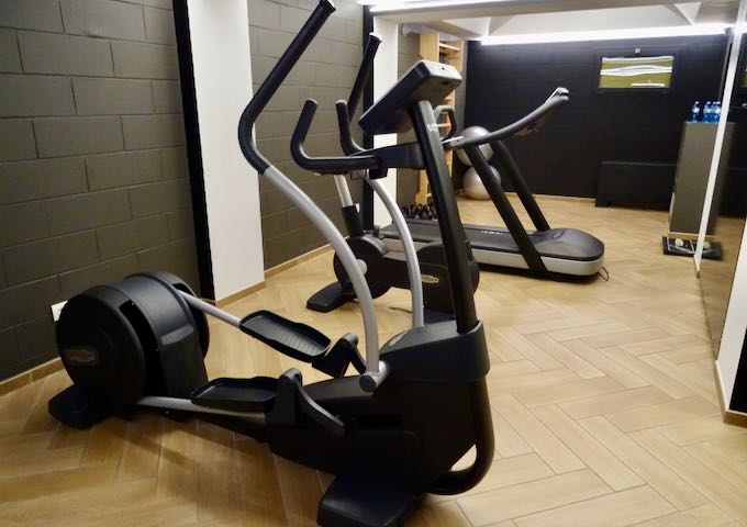 The gym is compact but well-equipped.