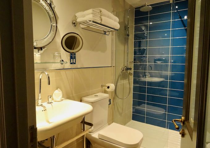 Bathrooms are modern and colorful.
